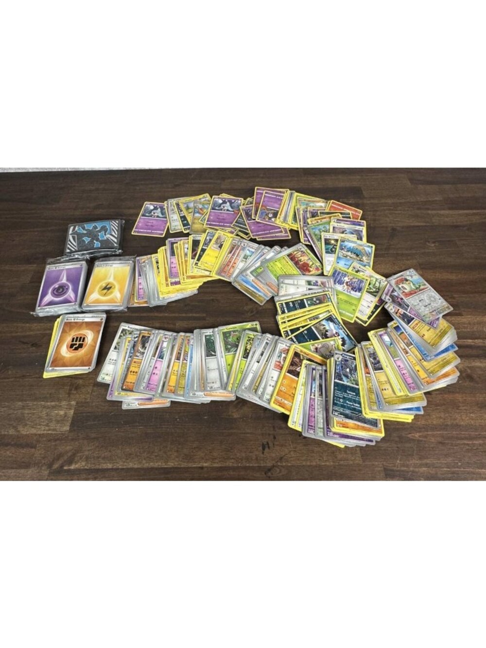337 POKEMON cards + energy & protective sleeves.